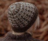 The Island and the Forest: A Knitted Correspondence