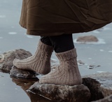 The Island and the Forest: A Knitted Correspondence